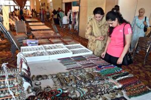 Visitors taking keen interest in different handmade items displayed by artisans during two day "Daachi Arts & Craft Exhibition" at Pak China Friendship Centre in the Federal Capital