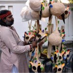 A vendor selling traditional bird nests on his bicycle at roadside