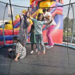 Children enjoying on trampoline during the closing ceremony of 3-day "Girls Sports Carnival 2024" organized by Ministry of Federal Education and Professional Training at Pakistan Sports Board