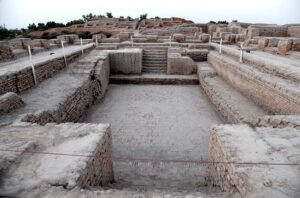 A view of street of world famous archeological site of Moen-Jo-Daro. SD area named after Khan Sahib AD Siddiqui representing the citadel or the upper city. It was excavated during the year 1922-28. It served as both religious and administrative center of Mohenjodaro. A Buddhist Stupa and a monastery of 2nd Century AD constructed on the ruins of the ancient citadel about sixteen hundred years after the destruction of Mohenjodaro. Among the important buildings of the citadel area are the Great Bath, State Granary and series of bath rooms and complete building, all probability a College of Priests.