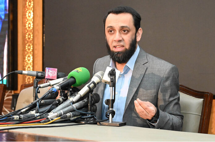 Federal Minister for Information, Broadcasting, National Heritage and Culture Attaullah Tarar addressing a press conference at 180H Model Town