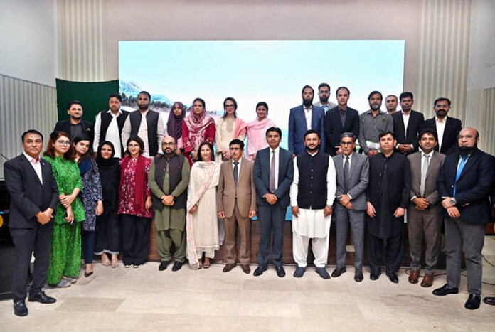 Director General PID, Ms. Tahira Saeeda in a group photograph during a seminar on 