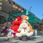 A vendor displaying teddy bears in his shop to attract customers at Jinnah Super Market in the Federal Capital