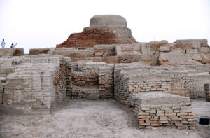 A view of street of world famous archeological site of Moen-Jo-Daro. SD area named after Khan Sahib AD Siddiqui representing the citadel or the upper city. It was excavated during the year 1922-28. It served as both religious and administrative center of Mohenjodaro. A Buddhist Stupa and a monastery of 2nd Century AD constructed on the ruins of the ancient citadel about sixteen hundred years after the destruction of Mohenjodaro. Among the important buildings of the citadel area are the Great Bath, State Granary and series of bath rooms and complete building, all probability a College of Priests.