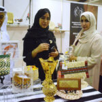 Foreigners visiting a stall at first Pakistan International Date Palm Festival at Expo Centre