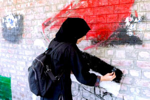 Students passionately create their vision of Al-Aqsa Mosque on the wall during a painting competition organized by Jamaat-e-Islami, celebrating national solidarity with Palestine in the Provincial Capital.