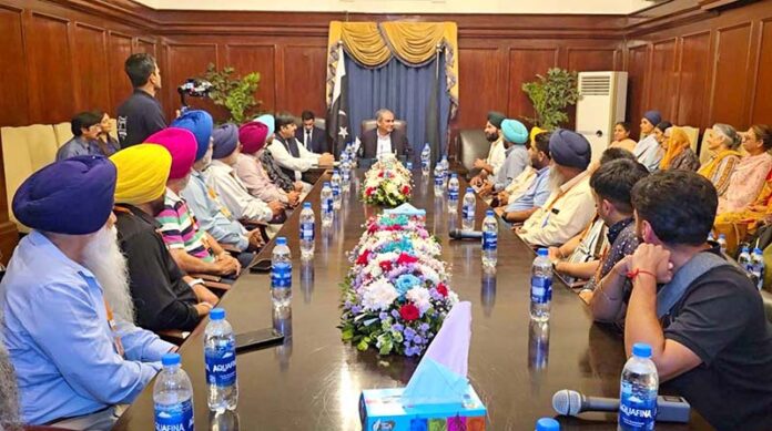 Interior Minister Mohsin Naqvi greeting Sikh Yaatris delegation from USA at State Guest House