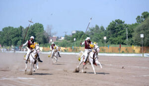 Players in action during Tent Pegging Championship in Sports Ground in connection of Rabi Kisan Mela at University of Agriculture Faisalabad (UAF).
