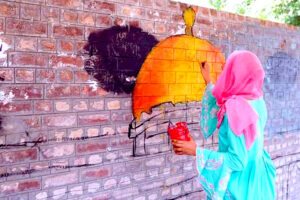 Students passionately create their vision of Al-Aqsa Mosque on the wall during a painting competition organized by Jamaat-e-Islami, celebrating national solidarity with Palestine in the Provincial Capital.