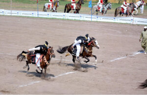 Players in action during Tent Pegging Championship in Sports Ground in connection of Rabi Kisan Mela at University of Agriculture Faisalabad (UAF).