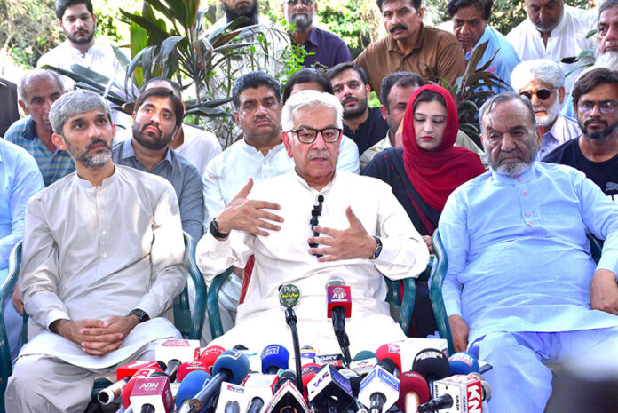 Defense Minister Khawaja Muhammad Asif addressing the media persons at his residence