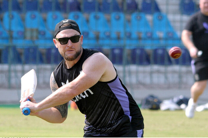 England's Head Coach Brendon McCullum gives catch practice during a training session before the first Test match against Pakistan at Multan Cricket Stadium