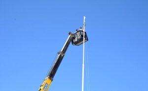 CDA workers painting the poles of the highest flag for preparation ahead of the 23rd Shanghai Cooperation Organization (SCO) summit at Zero Point in the Federal Capital.
