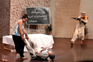 Artists performing Classical Theater Play "Taleem-e-Balghan” on the stage during the World Culture Festival 2024 at Arts Council of Pakistan Karachi late last night.