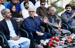 Defence Minister Khawaja Muhammad Asif talking to media persons at his residence