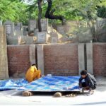 Workers are busy preparing traditional curtain (Chik) at their roadside setup