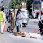 PTCL Workers laying cables at Dera Adda Chowk