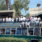 A large number of students traveling in a dangerous way on rooftop of passenger bus may cause any mishap and needs the attention of concerned authorities