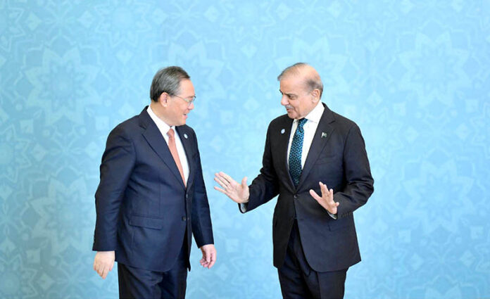 Prime Minister Muhammad Shehbaz Sharif receiving the Chinese Premier H.E. Li Qiang at the venue of the 23rd SCO Council of Heads of Government Meeting