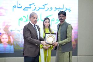 Prime Minister Muhammad Shehbaz Sharif presenting souvenirs to front line Polio Workers and the relatives of those Polio Workers who embraced martyrdom in the line of duty