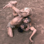 Traditional wrestlers (Pehalwans) are busy in practicing during a training session at an Akhara (wrestling pit).'Kushti', the traditional wrestling is one of the most popular games in Pakistan. Thousands of years ago when there was no cricket, no hockey, no football, the most enjoyable hobby of the people was wrestling. Even today after the introduction of so many kinds of sporting activities around the world, the sport of wrestling draws more crowds than any other sport because, fighting is a part of human nature. There are different styles of wrestling in the world today but the most famous among them is the Freestyle Wrestling