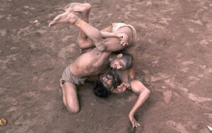 Traditional wrestlers (Pehalwans) are busy in practicing during a training session at an Akhara (wrestling pit).'Kushti', the traditional wrestling is one of the most popular games in Pakistan. Thousands of years ago when there was no cricket, no hockey, no football, the most enjoyable hobby of the people was wrestling. Even today after the introduction of so many kinds of sporting activities around the world, the sport of wrestling draws more crowds than any other sport because, fighting is a part of human nature. There are different styles of wrestling in the world today but the most famous among them is the Freestyle Wrestling