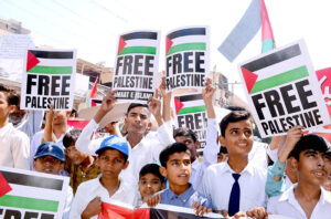 Students from a local private school hold a rally in Latifabad, expressing their solidarity with the people of Palestine on the Day of Solidarity.