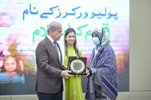 Prime Minister Muhammad Shehbaz Sharif presenting souvenirs to front line Polio Workers and the relatives of those Polio Workers who embraced martyrdom in the line of duty