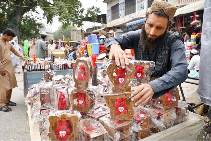A vendor displaying beautiful decoration pieces on his handcart to attract customers near Mohallah Jhangi A vendor displaying beautiful decoration pieces on his handcart to attract customers near Mohallah Jhangi