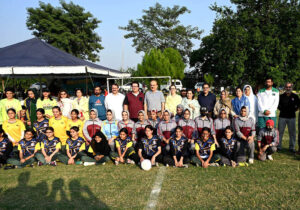 Federal Secretary, MoFE&PT, Mohyuddin Ahmad Wani in a group photograph with Students during 3-day "Girls Sports Carnival 2024" organized by Ministry of Federal Education and Professional Training at Pakistan Sports Complex