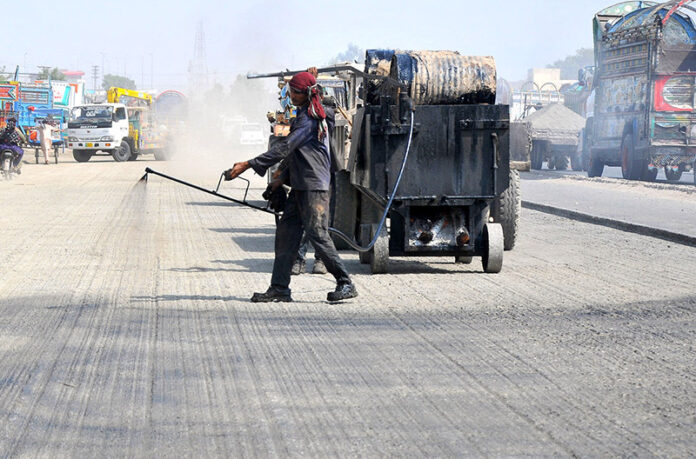 Labourers are busy with construction work on Bahawalpur Road during development work in the city