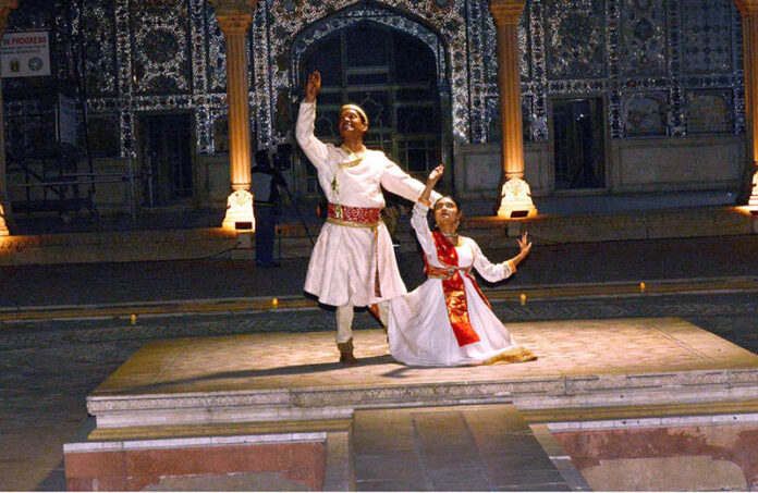 Artists perform Kathak dance on stage late night at the Royal Kitchen (Shahi Qilla)