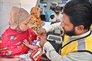 Health worker administering polio drop to a child during an anti-polio campaign 28th October to 3rd November at Bhitai Hospital