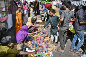 Vendors displaying the fireworks stuff to attract the customers in connection with upcoming Hindu festival Dewali at Faqir Ka Pir Bazaar