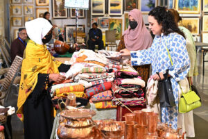 People visiting stalls during the "Daachi Arts & Craft Exhibition" at Pak China Friendship Centre