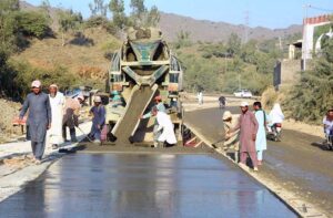 Laborers busy in construction work of District Mohmand Road during development work.