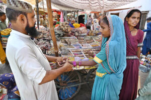 Vendors displaying the fireworks stuff to attract the customers in connection with upcoming Hindu festival Dewali at Faqir Ka Pir Bazaar