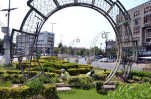 PHA workers planting new fragrant and shade trees to beautify the green belt on Jail Road.