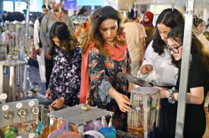 Visitors taking keen interest in different handmade items displayed by artisans during two day "Daachi Arts & Craft Exhibition" at Pak China Friendship Centre in the Federal Capital