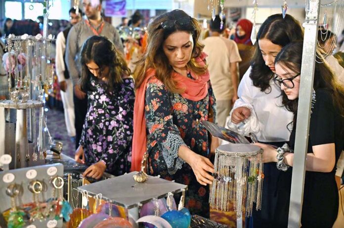 Visitors taking keen interest in different handmade items displayed by artisans during two day 