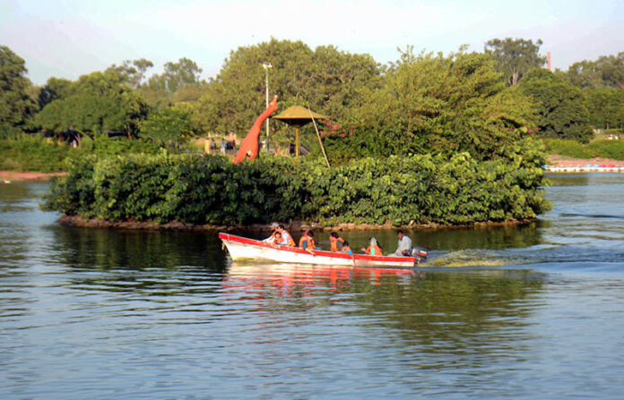 People enjoy boat ride at Gulshan iqbal Park