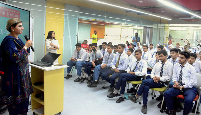 Senator Samina Mumtaz Zehri addressing students during the COP Simulation Programme, organized by the Ministry of Climate Change and Environmental Coordination at Habib University