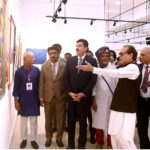 Governor of Khyber-Pakhtoonkhwa Faisal Kareem Kundi, alongside Sindh Minister for Culture and Tourism Zulfikar Shah, views paintings after inaugurating the 'Sindh Artists Exhibition' at the World Culture Festival, held at the Arts Council of Pakistan