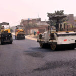 Laborers are carpeting the Lodhi colony road during the city development work