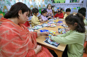 Teacher imparting knowledge to new generation on World Teachers' Day at a private school.