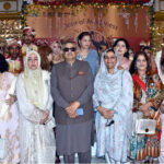Newlyweds in a group photo with Rabia Humayun, Sohail Waraich, Nusrat Hamdan and others at the mass event organized by Door of Awareness