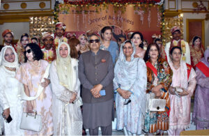 Newlyweds in a group photo with Rabia Humayun, Sohail Waraich, Nusrat Hamdan and others at the mass event organized by Door of Awareness