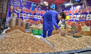 With the cold weather setting in, a dry fruit vendor showcases different verity of dry fruits on Davies Road , as high demand pushes prices upward. The seasonal rush is in full swing in the city.