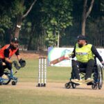 Players in action during the wheelchair cricket match between Sindh and Khyber Pakhtunkhwa teams for the Interloop Quaid-e-Azam T-20 Cup Wheelchair Cricket 2024 at Bohran Wali Ground