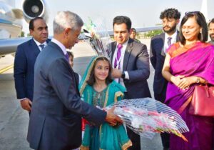 Indian Minister of External Affairs Subrahmanyam Jaishankar being presented flower bouquet by children on his arrival at Nur Khan Airbase.